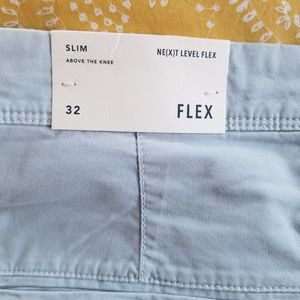 AE slim flex shorts, light blue